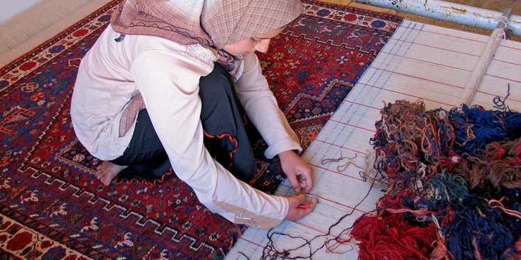 Kneeling and hand weaving