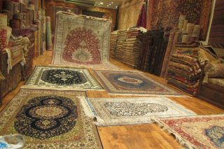 an array of rugs at a store in Istanbul, chicken