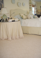 A wall-to-wall carpet in a bedroom