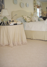 A wall-to-wall carpet in a bedroom