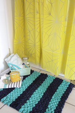 make your very own woven bath mat with finger-knit fabric yarn using this easy tutorial over at title=