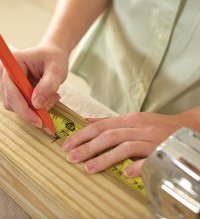 Making marks on lumber to construct a Do-it-yourself rolling storage space solution