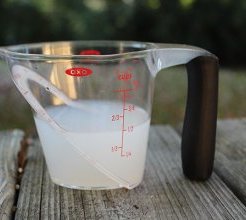 Measuring Cup with rug cleaning fluid