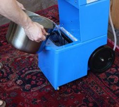 Pouring Carpet Cleaning fluid into Rental Carpet Cleaner