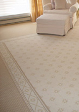 Wall-to-wall carpeting with an inset.